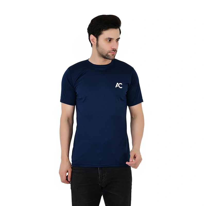 Male model in navy blue sports t-shirt with AC logo print and black jeans - menswear ecommerce photography by Lohar Studio Delhi
